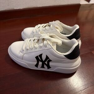 Selling my white NY sneaker, worn only once, still in like-new condition. no box